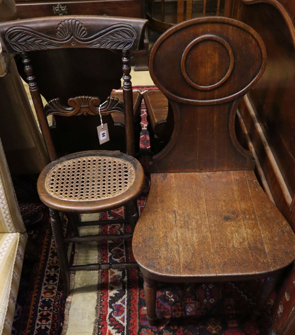 A Regency mahogany correction chair, a George III mahogany hall chair and two Victorian hall chairs